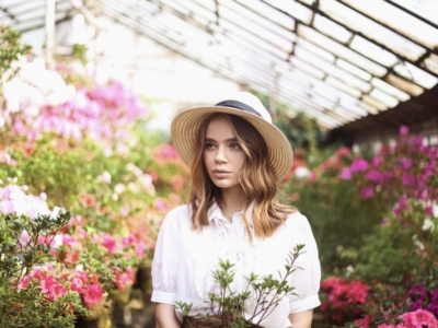 woman standing in greenhouse